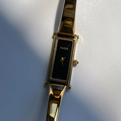 Gucci 1990s Rectangular Black Dial Gold Plated Bangle Watch