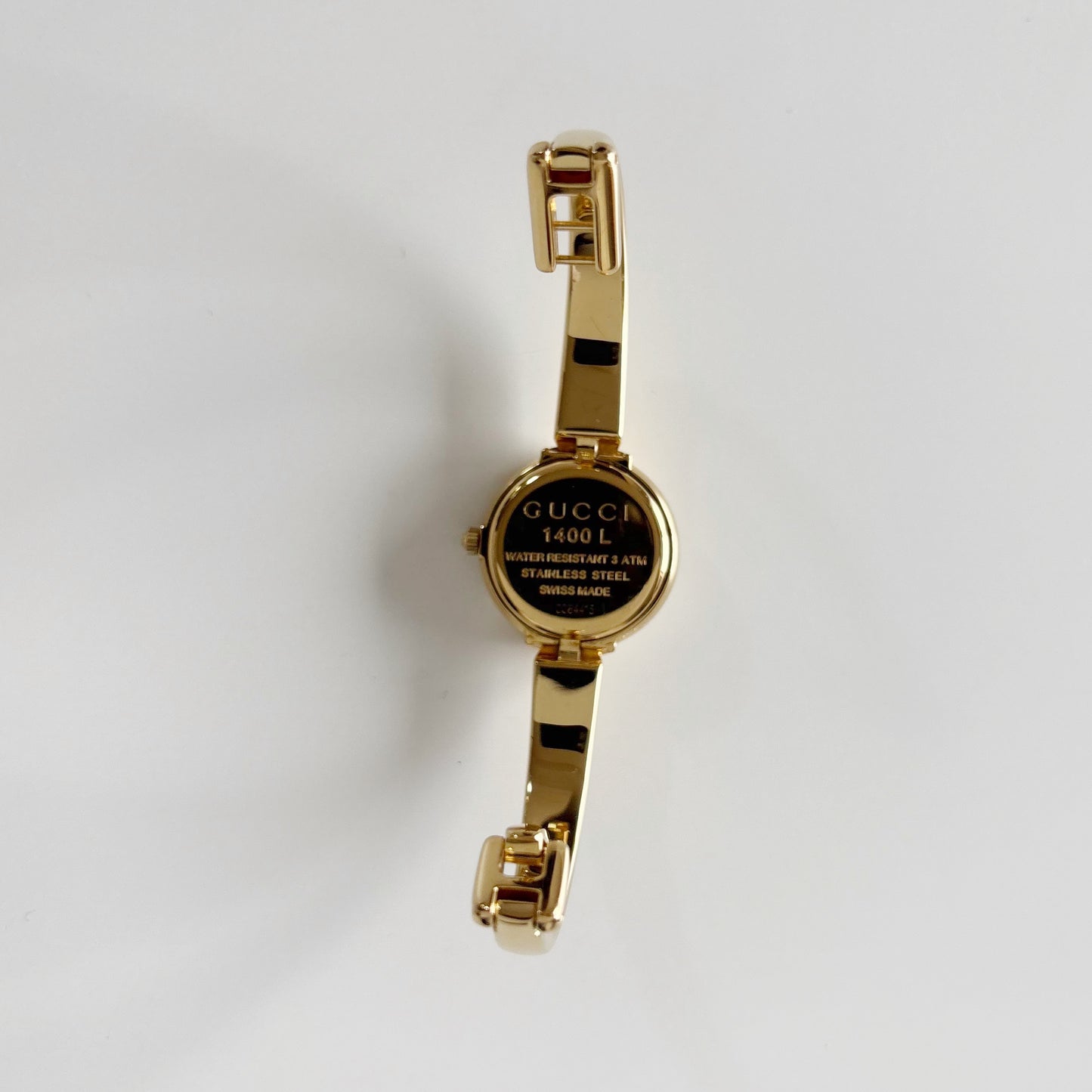 Gucci 1990s Round Dial Gold Plated Bangle Watch (Small)