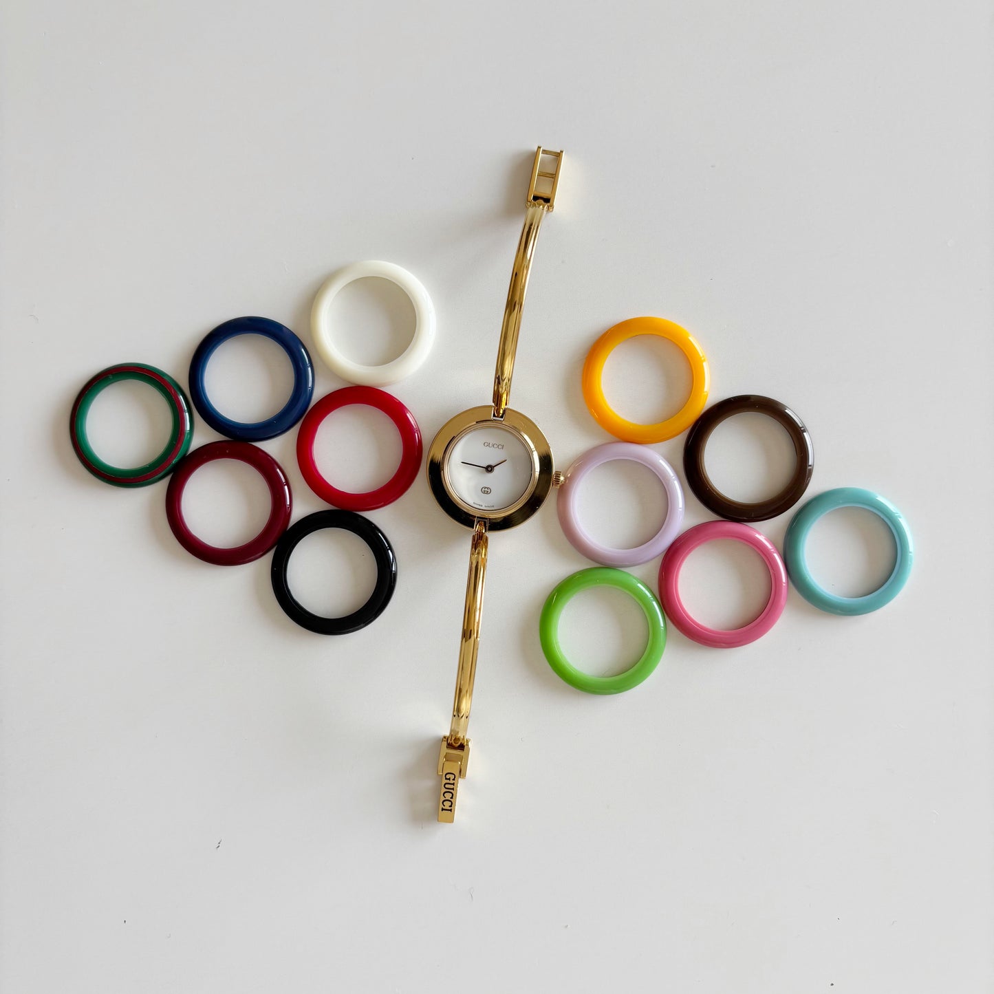 Gucci 1990s Interchangeable Bezel Gold Plated Bangle Watch with 12 bezels, case (Small)