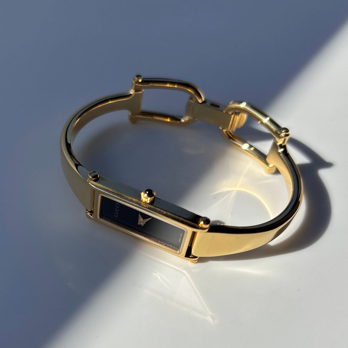 Gucci 1990s Black Dial Gold Plated Bangle Watch