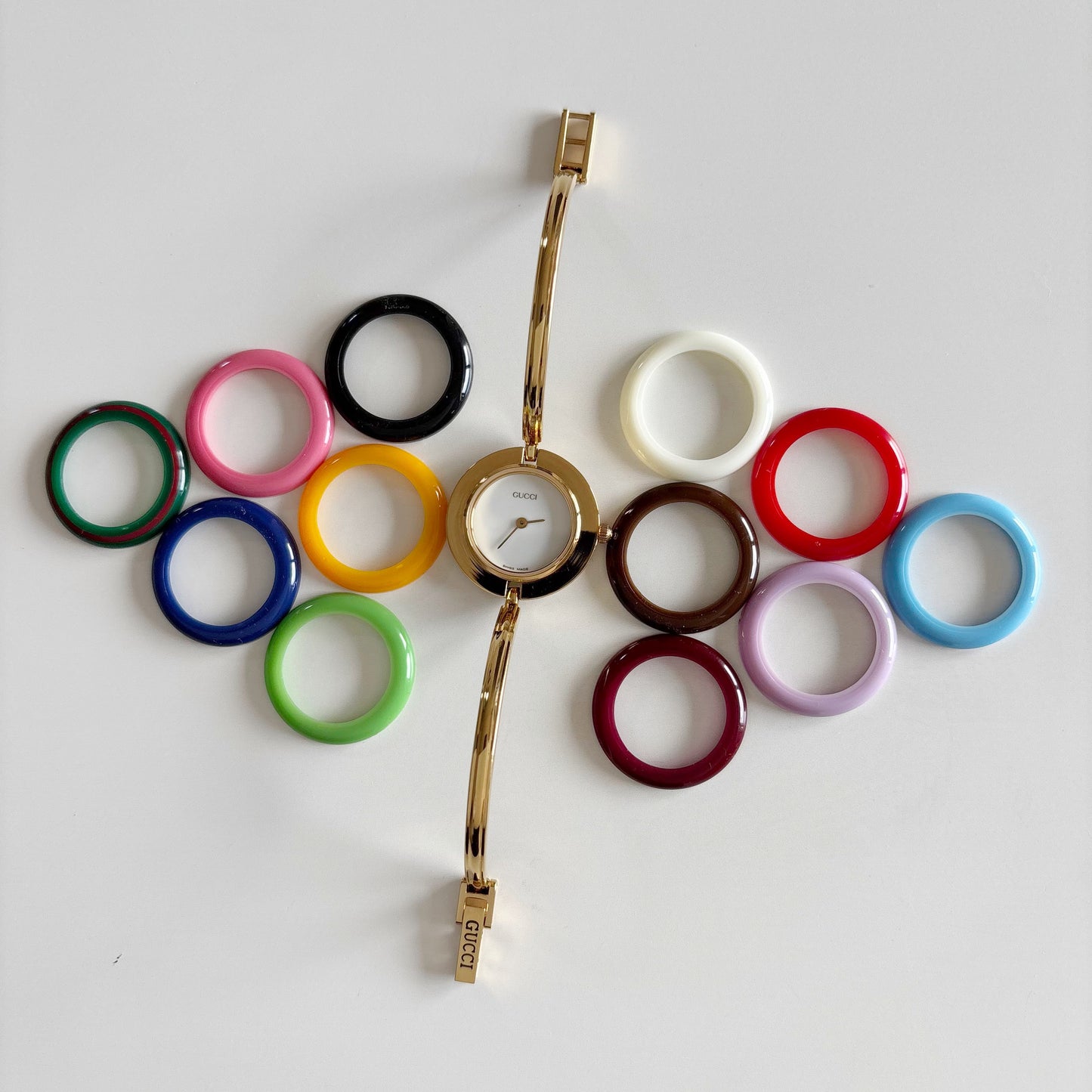 Gucci 1990s Interchangeable Bezel Gold Plated Bangle Watch with 12 bezels, case