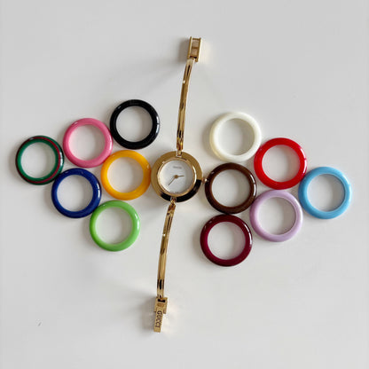 Gucci 1990s Interchangeable Bezel Gold Plated Bangle Watch with 12 bezels, case