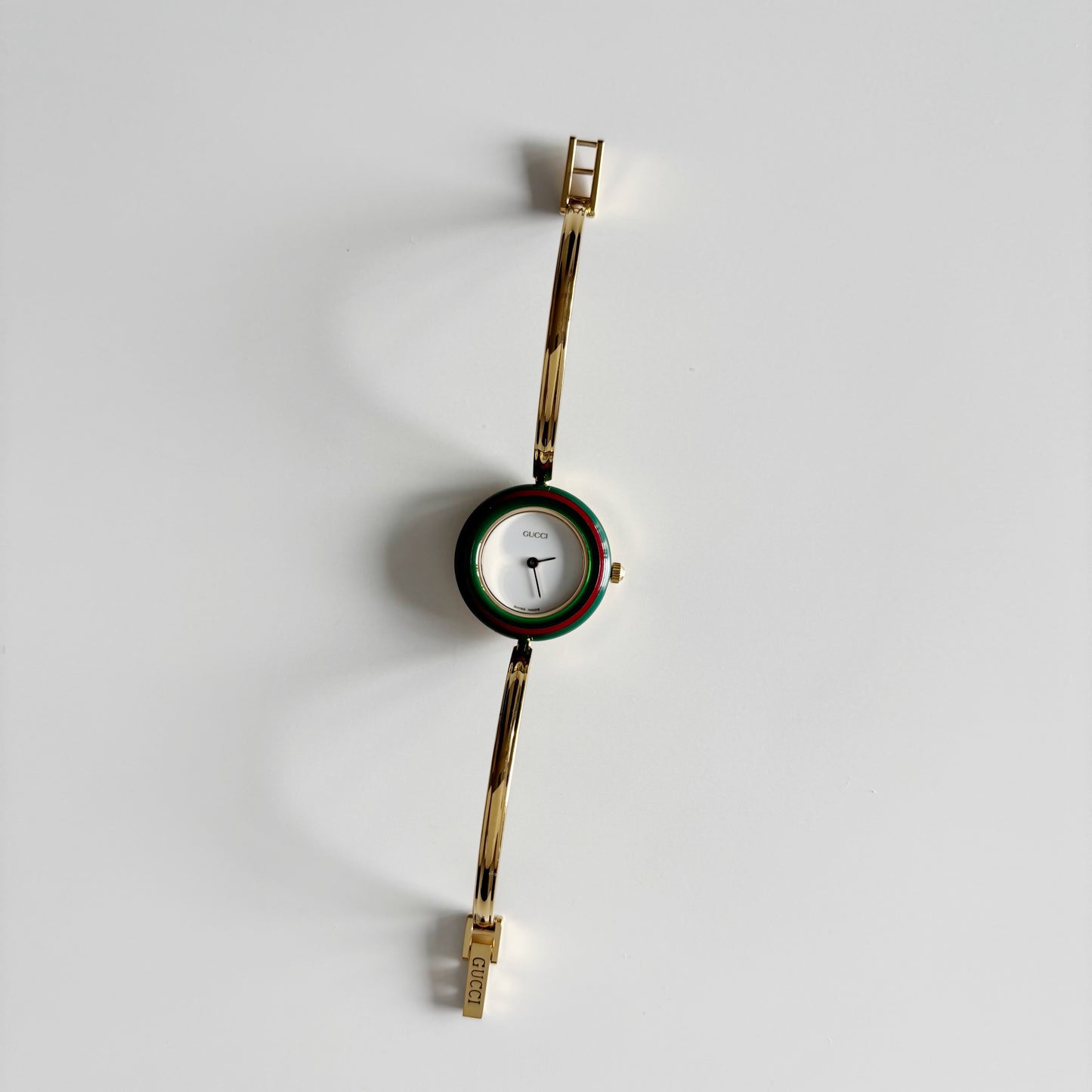 Gucci 1990s Interchangeable Bezel Gold Plated Bangle Watch with 12 bezels, case