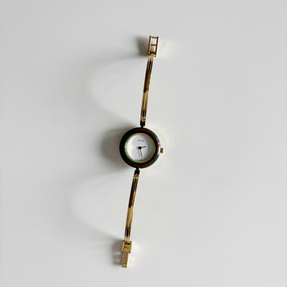 Gucci 1990s Interchangeable Bezel Gold Plated Bangle Watch with 12 bezels, case