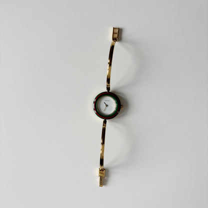 Gucci 1990s Interchangeable Bezel Gold Plated Bangle Watch with 12 bezels, case