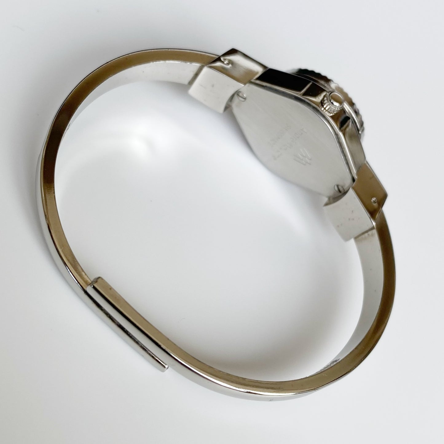 André Mouche Early 2000s Peek-A-Boo Silver Bangle Watch