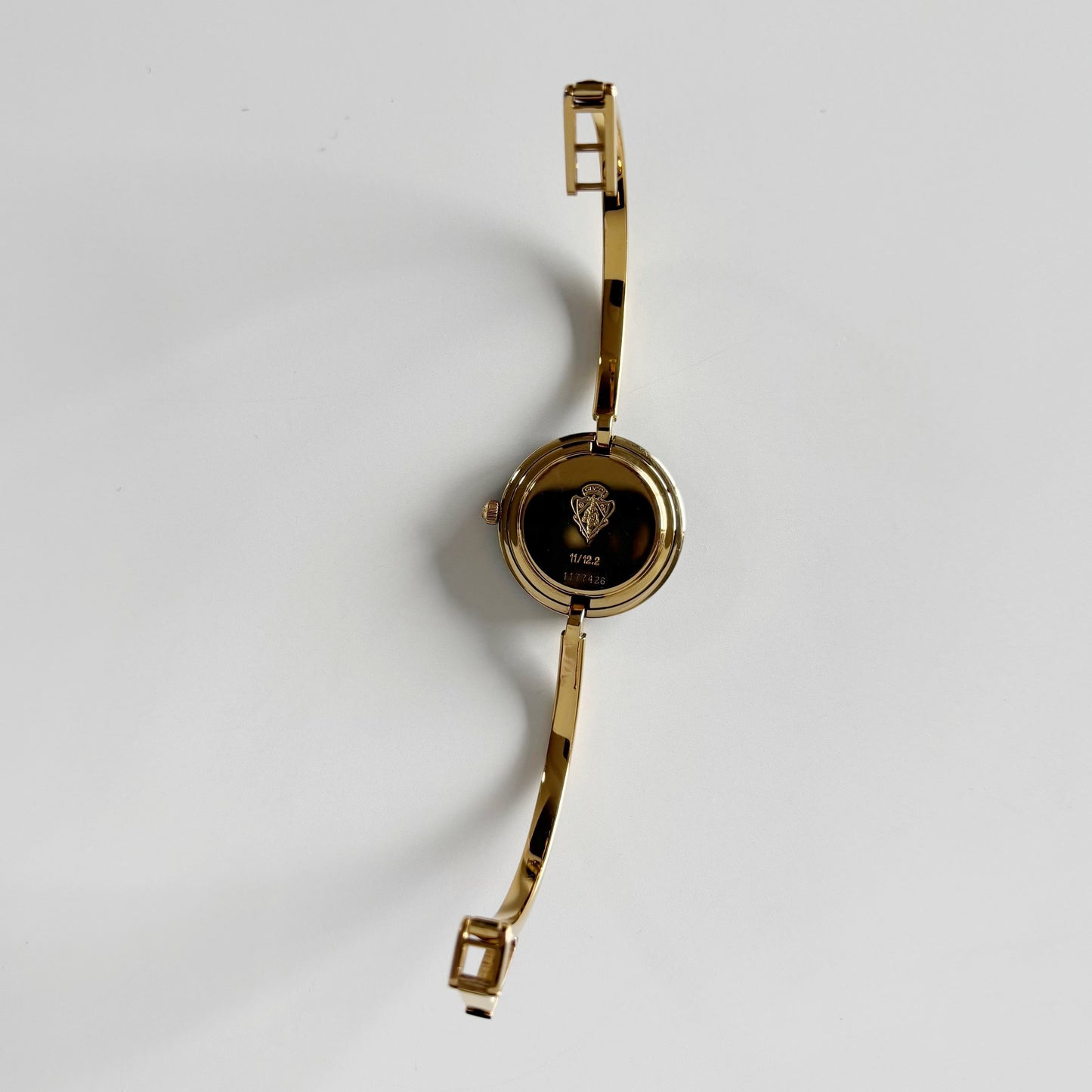 Gucci 1990s Interchangeable Bezel Gold Plated Bangle Watch with 12 bezels, case