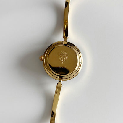 Gucci 1990s Interchangeable Bezel Gold Plated Bangle Watch with 12 bezels, case