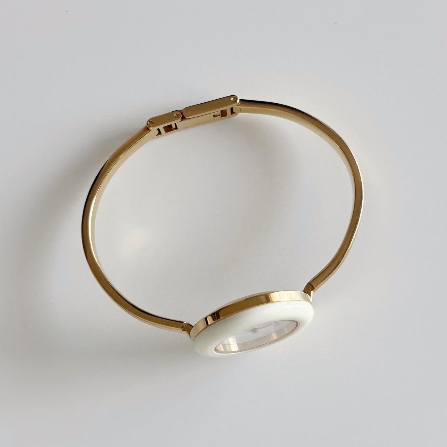 Gucci 1990s Interchangeable Bezel Gold Plated Bangle Watch with 12 bezels, case