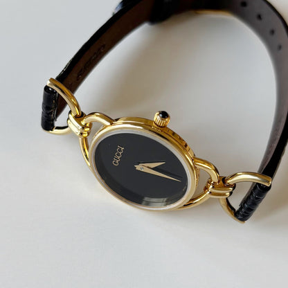 Gucci 1990s Black Round Dial Horsebit Gold Plated Watch