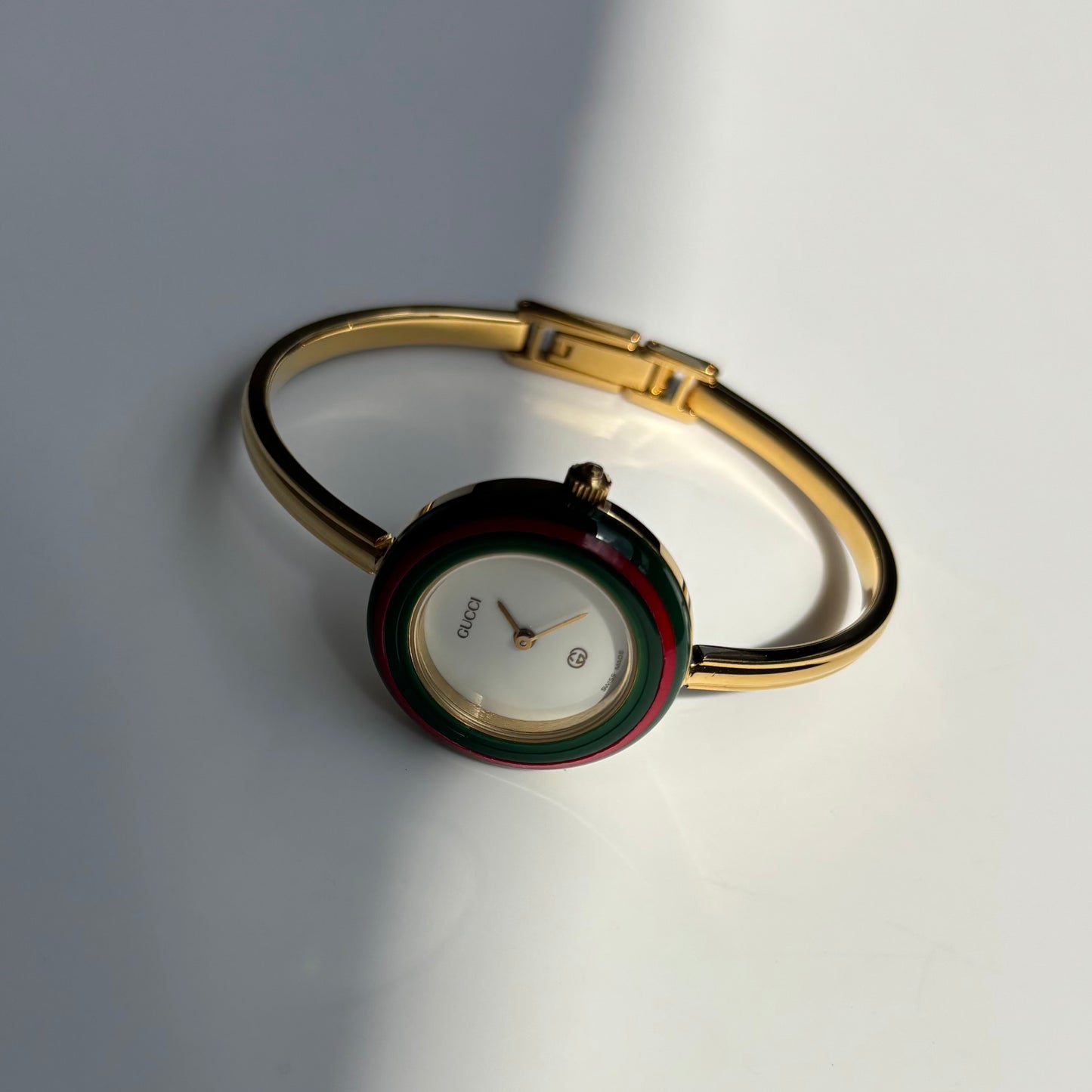 Gucci 1990s Interchangeable Bezel Gold Plated Bangle Watch with 12 bezels, case