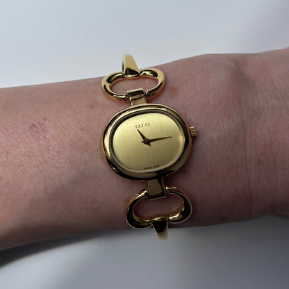 Gucci 1990s Oval Gold Dial Gold Plated Bangle Watch (Small)
