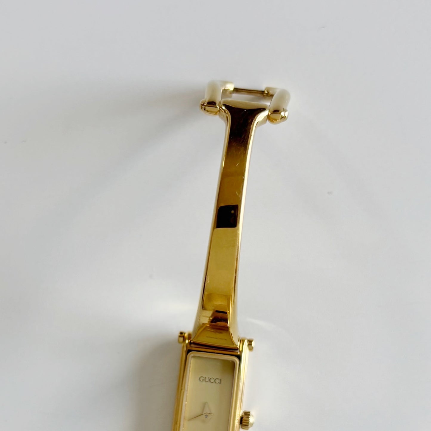 Gucci 1980s Rectangular Gold Dial Gold Plated Bangle Watch