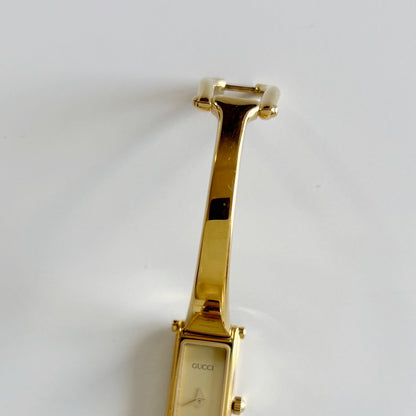 Gucci 1980s Rectangular Gold Dial Gold Plated Bangle Watch