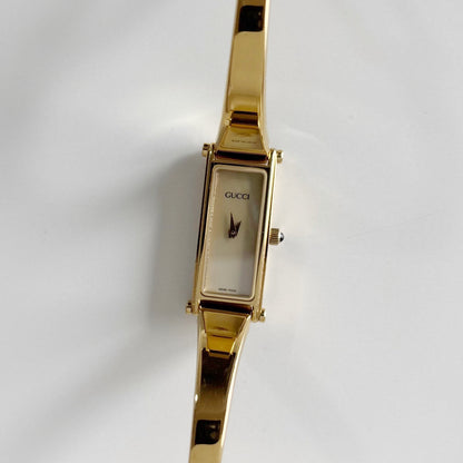 Gucci 1990s Rectangular Seashell Dial Gold Plated Bangle Watch