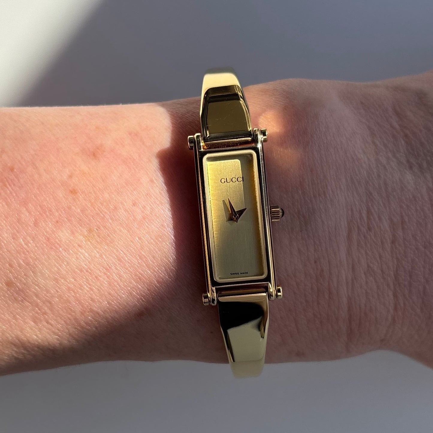 Gucci 1990s Rectangular Dial Gold Plated Bangle Watch