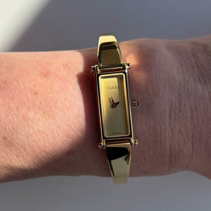 Gucci 1990s Rectangular Dial Gold Plated Bangle Watch