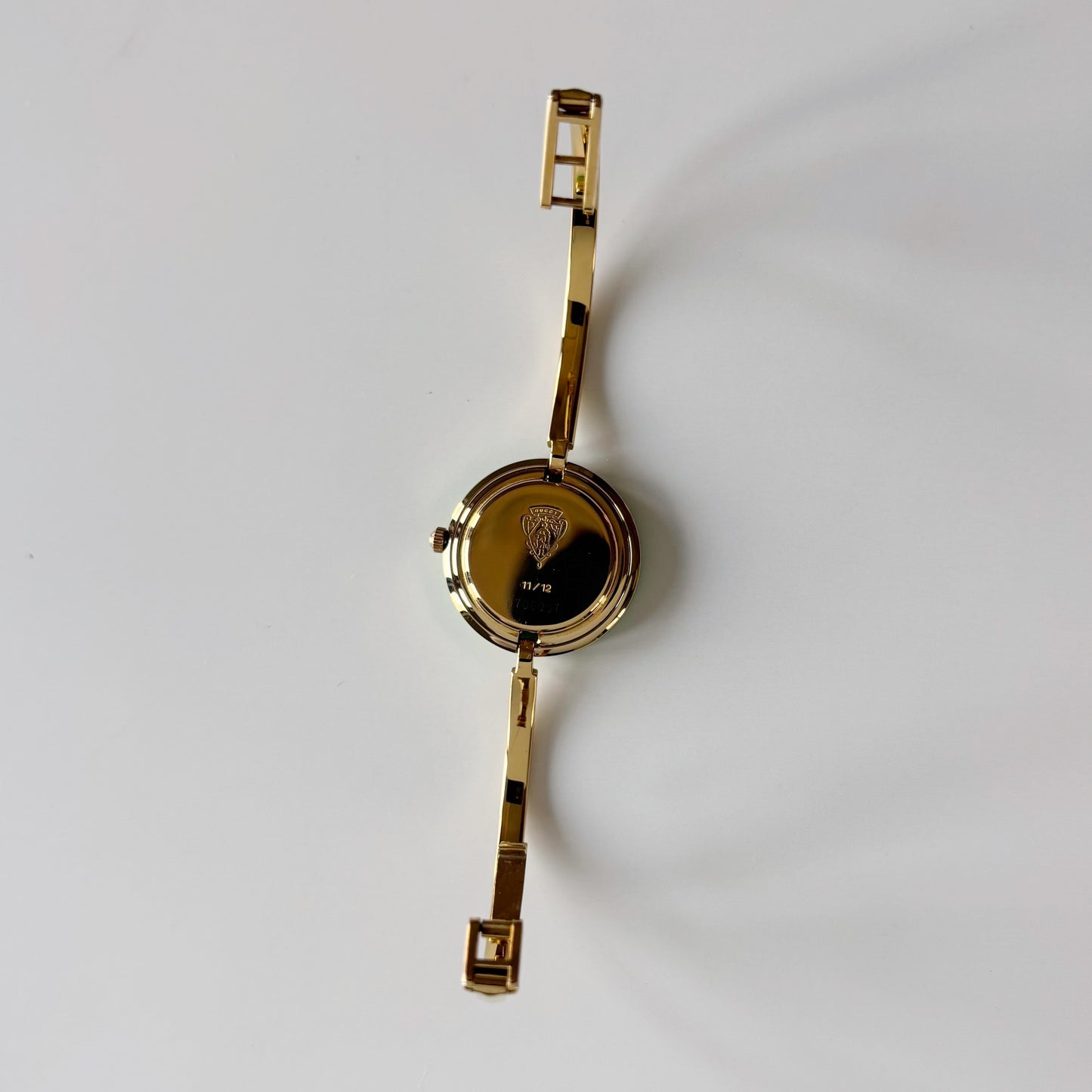 Gucci 1990s Interchangeable Bezel Gold Plated Bangle Watch with 12 bezels, case