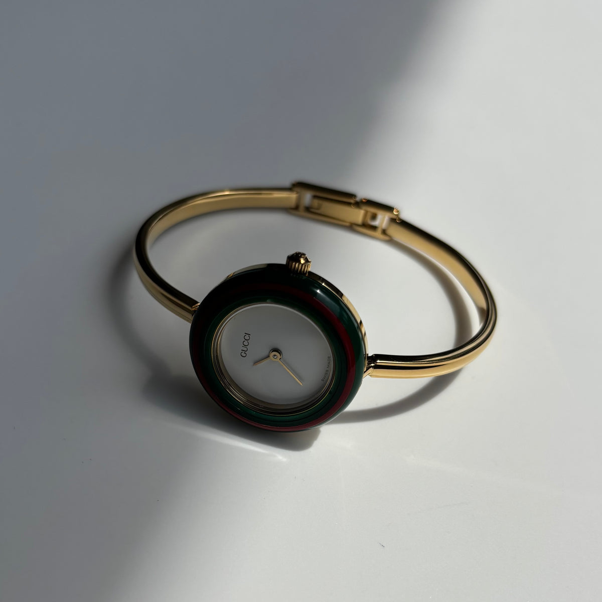 Gucci 1990s Interchangeable Bezel Gold Plated Bangle Watch with 12 bezels, case