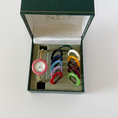 Gucci 1990s Interchangeable Bezel Gold Plated Bangle Watch with case, 12 bezels