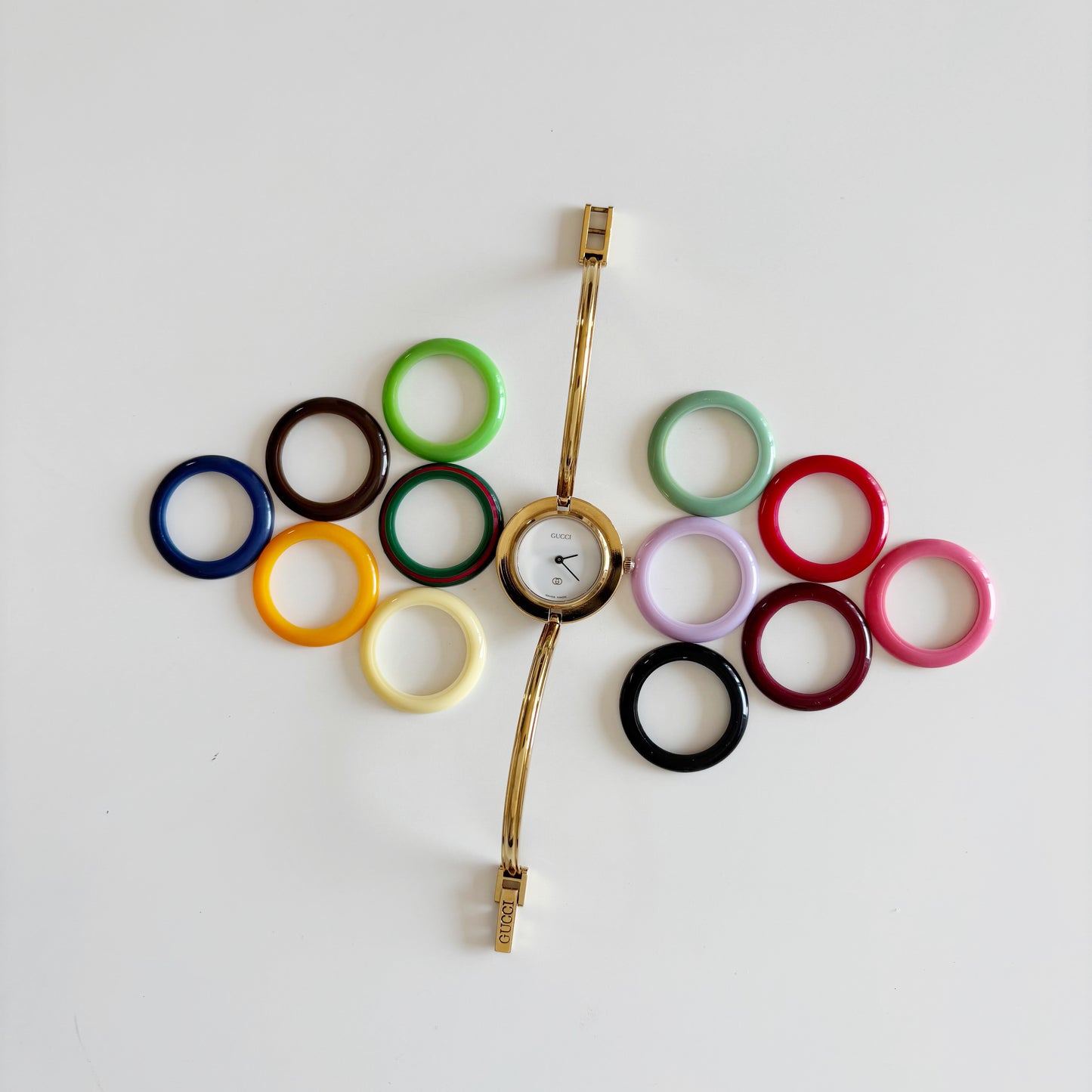 Gucci 1990s Interchangeable Bezel Gold Plated Bangle Watch with 12 bezels, case