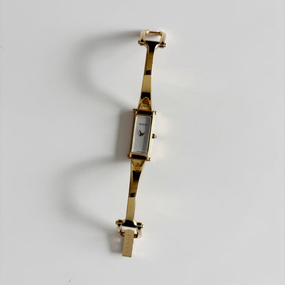 Gucci 1990s Seashell Rectangular Dial Gold Plated Bangle Watch (Small)