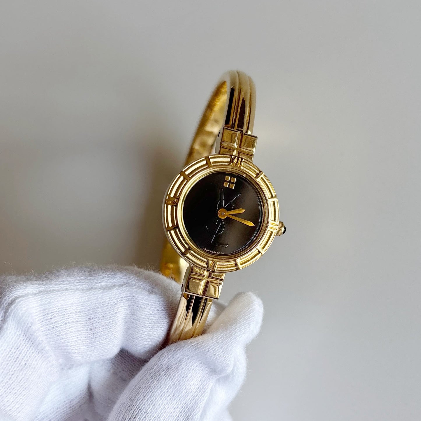 Yves Saint Laurent 1990s Black Round Dial Gold Plated Bangle Watch