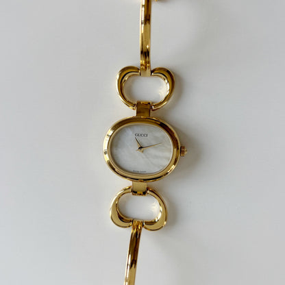 Gucci 1990s Seashell Oval Dial Gold Plated Bangle Watch (Small)