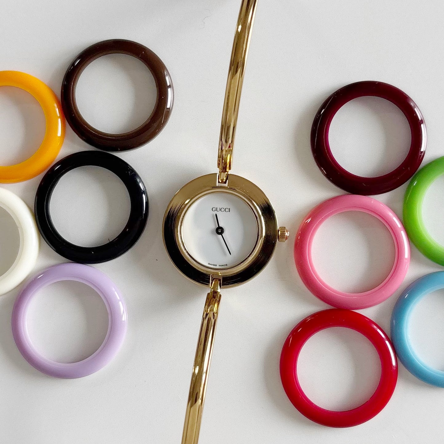 Gucci 1990s Interchangeable Bezel Gold Plated Bangle Watch with 12 bezels, case