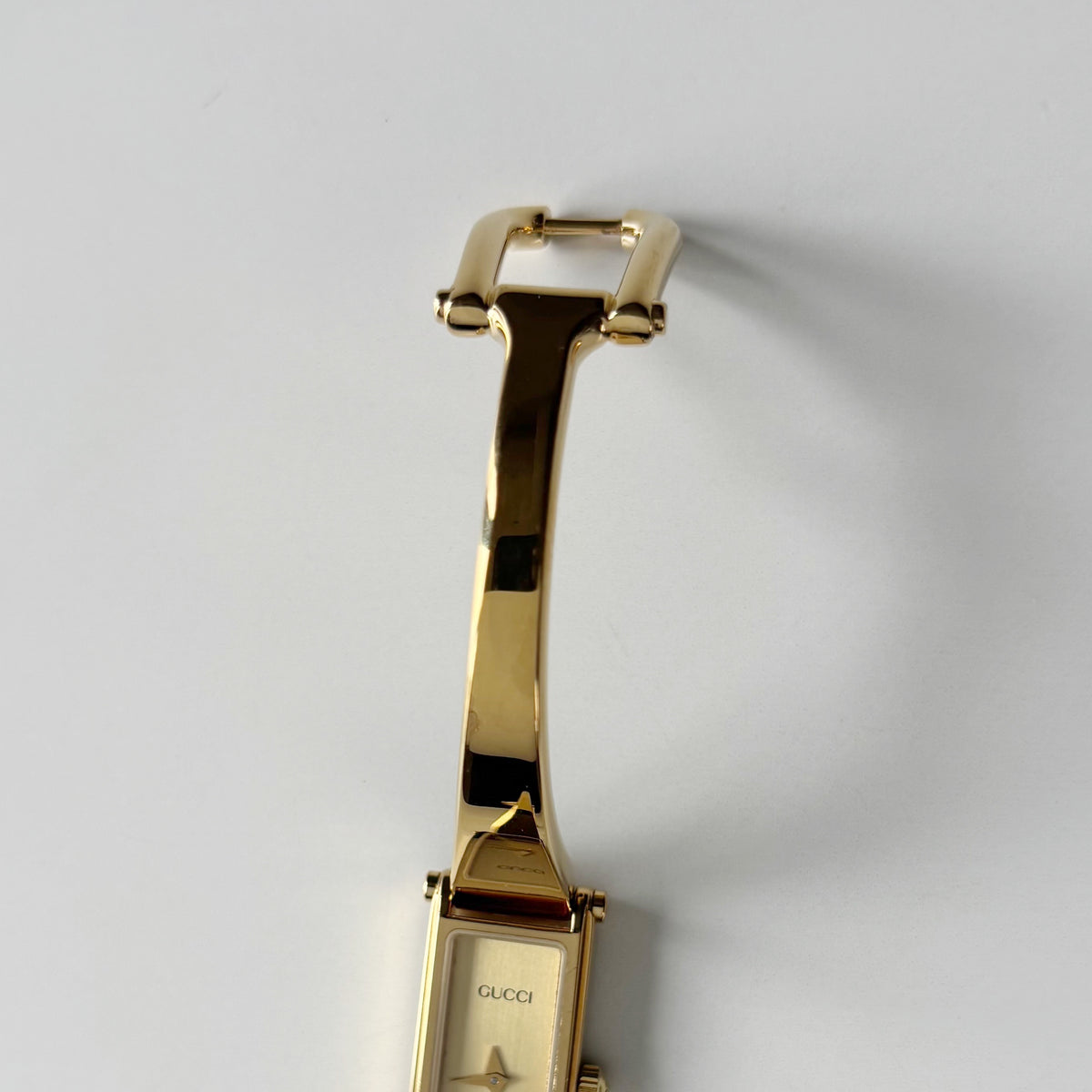 Gucci 1990s Gold Rectangular Dial Gold Plated Bangle Watch