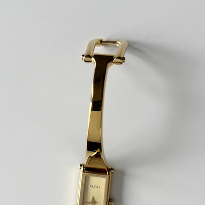 Gucci 1990s Gold Rectangular Dial Gold Plated Bangle Watch