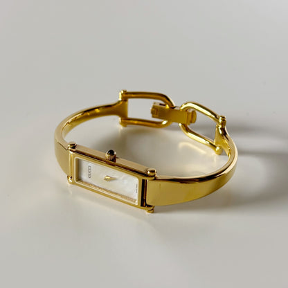 Gucci 1990s Seashell Rectangular Dial Gold Plated Bangle Watch