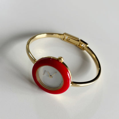 Gucci 1990s Interchangeable Bezel Gold Plated Bangle Watch with case, 12 bezels (Small)