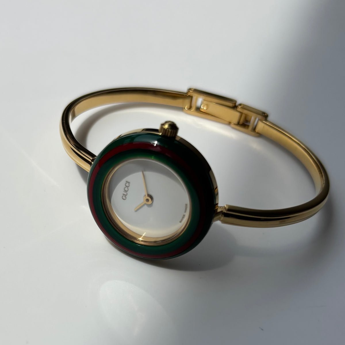 Gucci 1990s Interchangeable Bezel Gold Plated Bangle Watch with 12 bezels, case