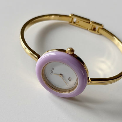 Gucci 1990s Interchangeable Bezel Gold Plated Bangle Watch with 12 bezels, case