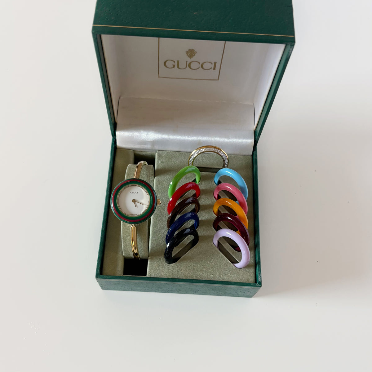 Gucci 1990s Interchangeable Bezel Gold Plated Bangle Watch with 12 bezels, case