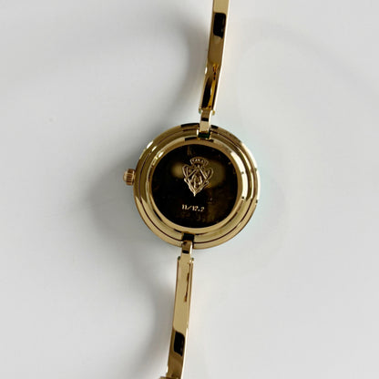 Gucci 1990s Interchangeable Bezel Gold Plated Bangle Watch with 12 bezels, case