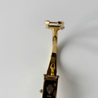 Gucci 1990s Gold Rectangular Dial Gold Plated Bangle Watch
