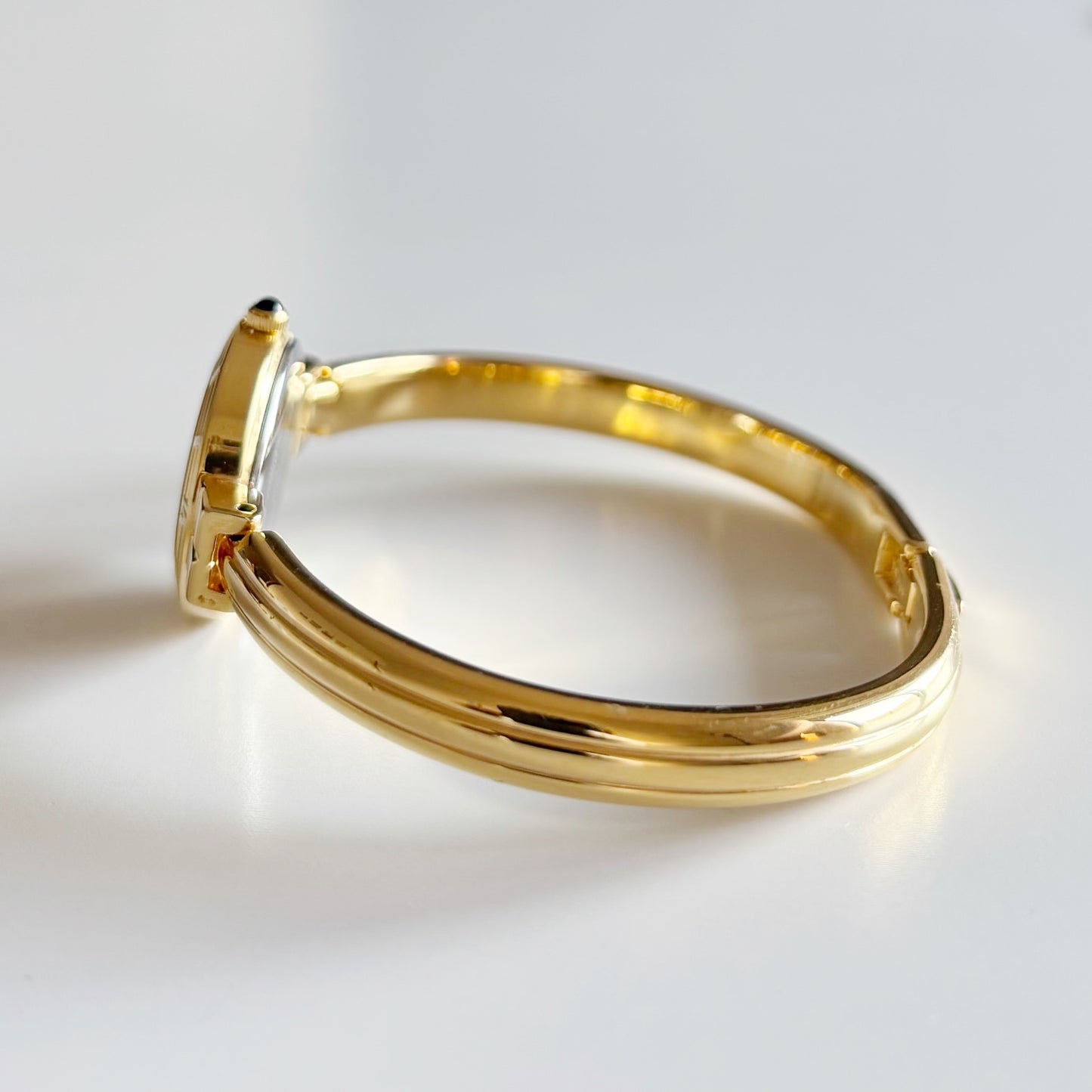 Yves Saint Laurent 1990s Black Round Dial Gold Plated Bangle Watch