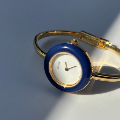 Gucci 1990s Interchangeable Bezel Gold Plated Bangle Watch with 12 bezels, case