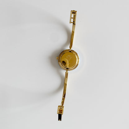 Gucci 1990s Interchangeable Bezel Gold Plated Bangle Watch with 12 bezels, case