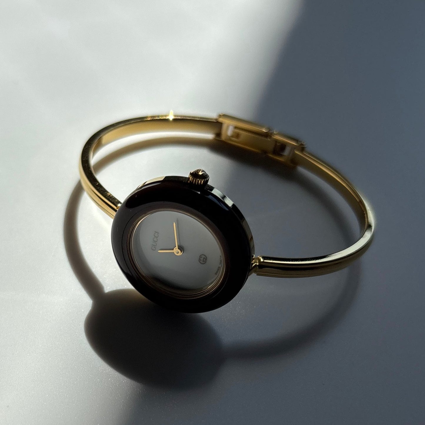 Gucci 1990s Interchangeable Bezel Gold Plated Bangle Watch with 12 bezels, case