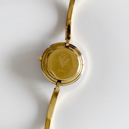 Gucci 1990s Interchangeable Bezel Gold Plated Bangle Watch with 12 bezels, case