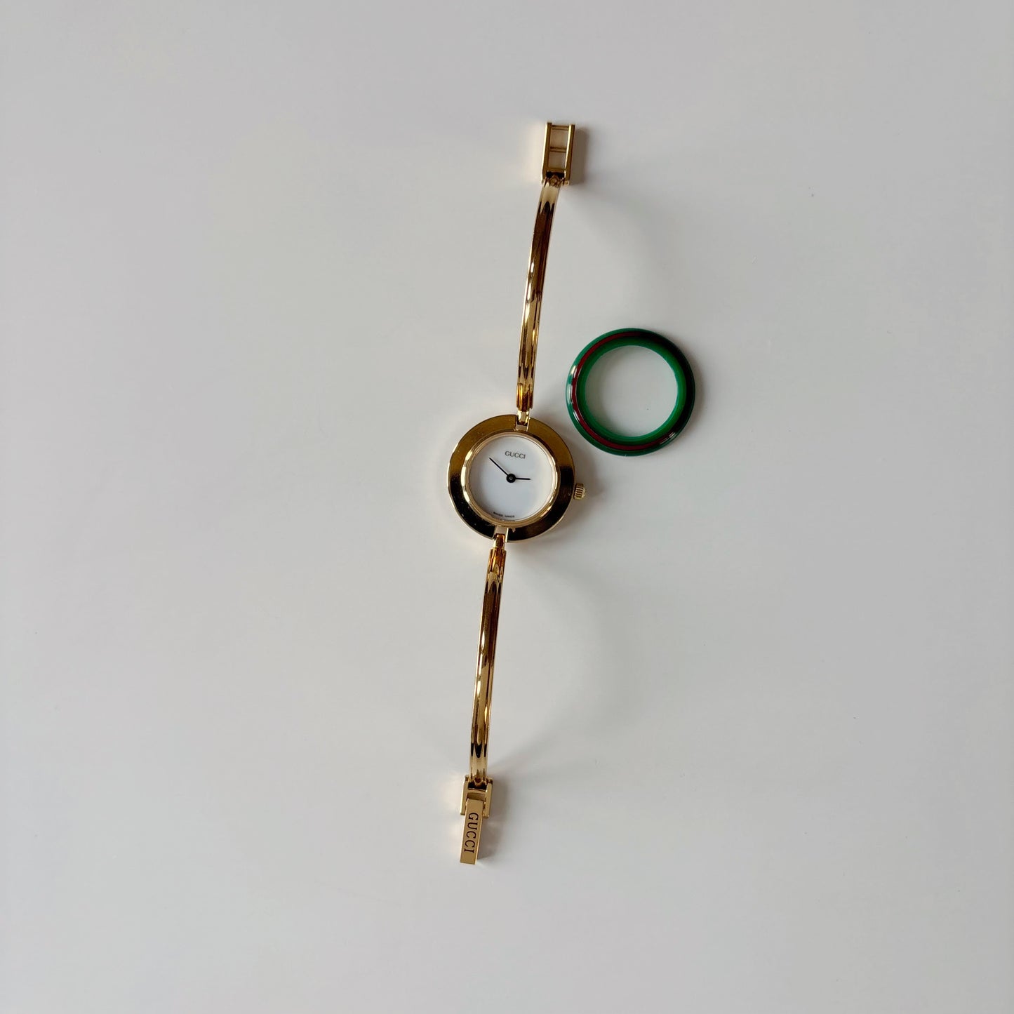 Gucci 1990s Interchangeable Bezel Gold Plated Bangle Watch with 12 bezels, case