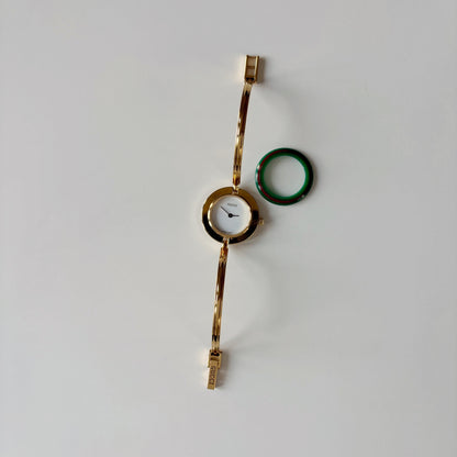 Gucci 1990s Interchangeable Bezel Gold Plated Bangle Watch with 12 bezels, case