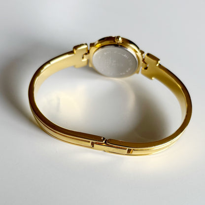 Givenchy 1990s Round Dial Gold Plated Bangle Watch