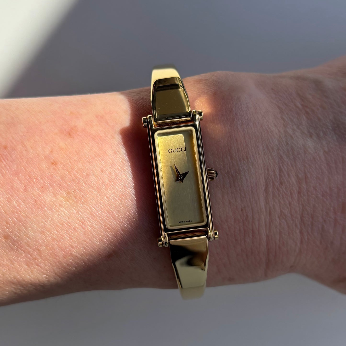 Gucci 1990s Rectangular Dial Gold Plated Bangle Watch