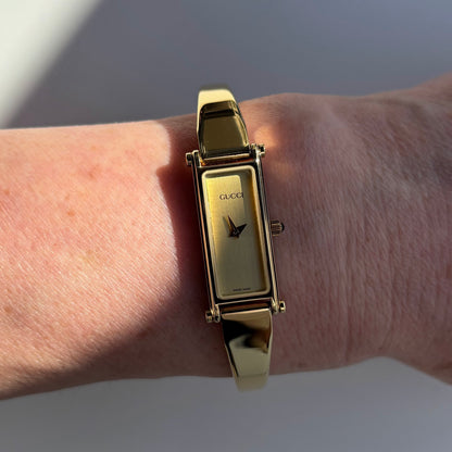Gucci 1990s Rectangular Dial Gold Plated Bangle Watch