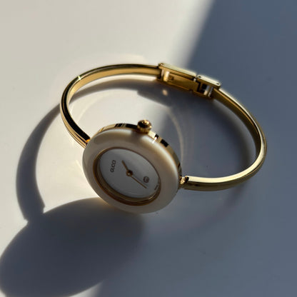 Gucci 1990s Interchangeable Bezel Gold Plated Bangle Watch with 12 bezels, case