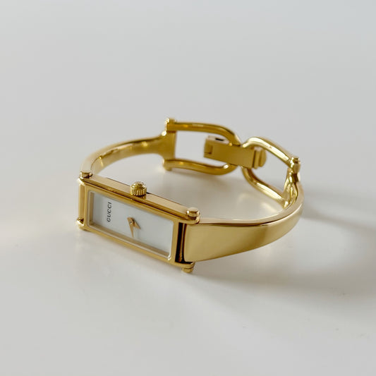 Gucci 1990s Seashell Rectangular Dial Gold Plated Bangle Watch (Small)